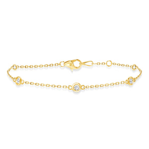 yellow gold diamond bezel train bracelet