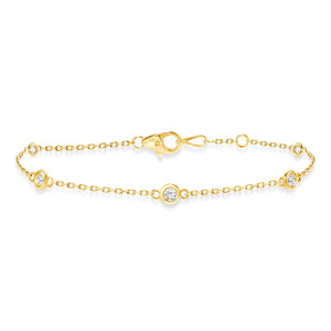 yellow gold diamond bezel train bracelet