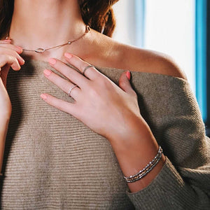 Woman Wearing Gold Ball Bracelet