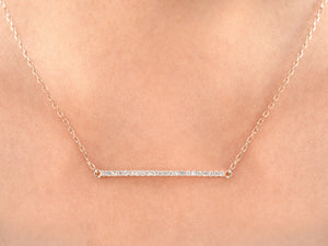white gold vertical bar necklace on woman 